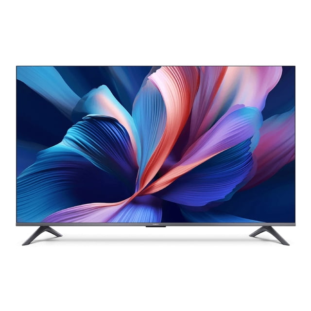 smart tv xiaomi tv a pro 65" qled 4k Televisor de 65 pulgadas con pantalla QLED 4K (3840 x 2160) y marco delgado, soportes tipo patas; muestra una imagen vibrante en azules y morados, DCI-P3 94%, HDR10+, y Google TV como sistema operativo. Ideal para cine en casa y streaming.