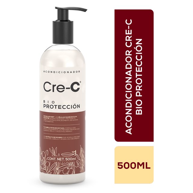 acondicionador cre-c bio protección 500 ml acondicionador en botella blanca con dispensador negro, etiqueta frontal con logo Cre-C y texto 'Bio Protección', banda marrón y motivos botánicos; señala Protección 360º con células madre de oliva silvestre, extracto de romero y fórmula que ayuda a equilibrar el pH y combatir el estrés oxidativo por rayos UV. Vista frontal, fondo blanco; también suele usarse para el mantenimiento diario del cuero cabelludo.