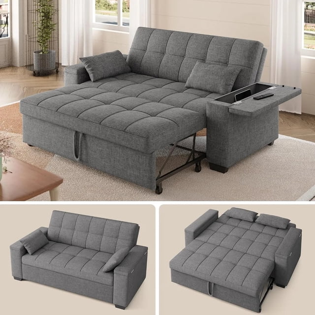sofá cama futón convertible 3 en 1 de lino, sofá cama tamaño queen con sofá extraíble, reposabrazos con espacio de almacenamiento y respaldo ajustable para sala de estar, gris oscuro — Vista 3/4 frontal del futón desplegado en modo cama queen (175 cm largo) con tapizado gris oscuro capitoné y respaldo en secciones. Brazo derecho extraíble con bandeja superior y compartimento visible; mecanismo de tirador y estructura metálica parcial en la base; incluye dos cojines lumbares. Ambientado sobre alfombra clara junto a cortinas, apto para apartamentos y estudios.