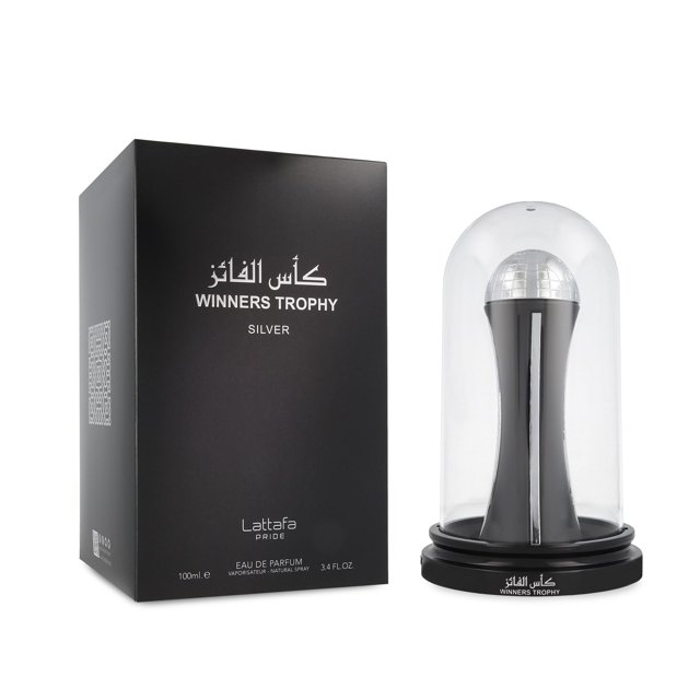 lattafa winners trophy silver 100ml edp spray lattafa model botella y caja frontal; botella plateada con forma de trofeo dentro de cúpula transparente sobre base negra con texto "Winners Trophy", caja negra con logo Lattafa y texto blanco, contenido 100 ml, fragancia unisex aromática con notas de incienso, naranja, lavanda, vainilla, cedro y vetiver. Suele usarse también como pieza decorativa tipo trofeo en tocadores.
