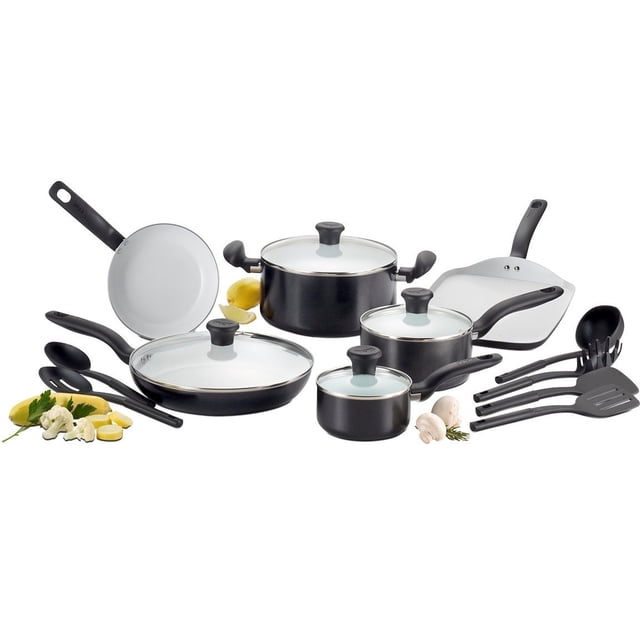 t-fal initiatives - juego de utensilios de cocina antiadherentes de cerámica, 16 piezas, apto para horno, ollas y sartenes 350f, color negro: vista frontal en 3/4 de un juego negro de 16 piezas con sartenes, cacerola y ollas con interior cerámico blanco, tapas de vidrio con pomos negros y mangos ergonómicos largos; incluye espátulas y cucharones negros; según especificaciones es apto para horno y resistente a 350°F; mostrado sobre fondo blanco con limón y champiñones. A menudo usado también para servir condimentos en la mesa.