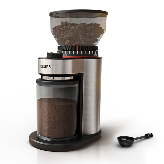 molinillo de café krups burr 18 ajustes de moler, 500 ml, negro — vista frontal centrada de un molinillo eléctrico de rebabas en acero inoxidable y negro con tolva transparente con granos, anillo giratorio de 18 posiciones de ultrafino a extra grueso, cámara de molienda extraíble con jarra colectora transparente llena de café molido y base ovalada; cucharilla dosificadora a un lado, adecuado para moler 2–20 tazas y limpieza sencilla; también suele usarse para moler especias en pequeñas cantidades.