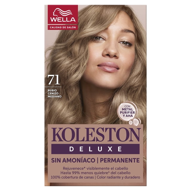 tinte para cabello koleston deluxe sin amoníaco rubio cenizo mediano 7.1 caja frontal con modelo de cabello rubio cenizo rizado hasta los hombros, número 7.1 y texto 'rubio cenizo mediano' a la izquierda, logotipo Wella en rojo en la esquina superior, sello circular 'con Metal Purifier y AHA' y franja inferior morada que indica 'Sin amoníaco | Permanente'.