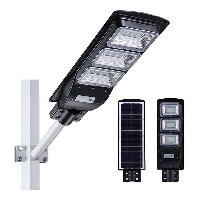 lampara suburbana solar 100w all in one lámpara solar negra 100W todo en uno con panel solar separado y brazo para fijar a la pared; vista 3/4 del cabezal rectangular con cuatro módulos LED visibles, carcasa PVC negra, control remoto y sensor de movimiento, IP66, batería 10–12 hrs y encendido nocturno automático, recomendable para montaje a 4–6 m; también adecuada para iluminar caminos y entradas exteriores.