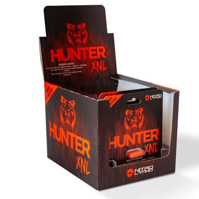 suplemento alimenticio para hombre 12 cápsulas apoyo para energía, vitalidad y rendimiento físico hunter xnl caja expositora 3/4 frontal con diseño oscuro y texto naranja, blíster individual visible en el frente, logotipo de tigre y marca Hunter XNL en letra grande sobre fondo blanco; a menudo se utiliza como muestra en puntos de venta.