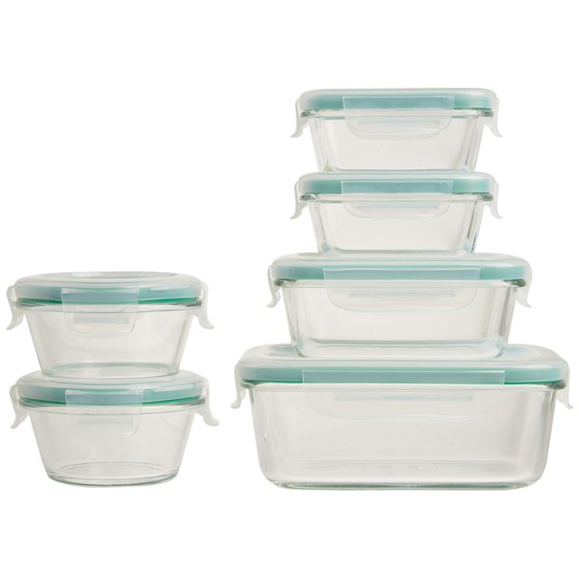 set de recipientes de vidrio oxo good grips smart seal, 12 piezas juego apilable y anidable con tapas azules; incluye dos rectangulares 4 oz, dos redondos 1 taza, uno de 1.6 tazas y dos rectangulares de 3.5 tazas; tapas con cuatro pestañas de bloqueo y sellos de silicona removibles, apto para horno, microondas, congelador y lavavajillas; también suele usarse para organizar ingredientes en despensas.