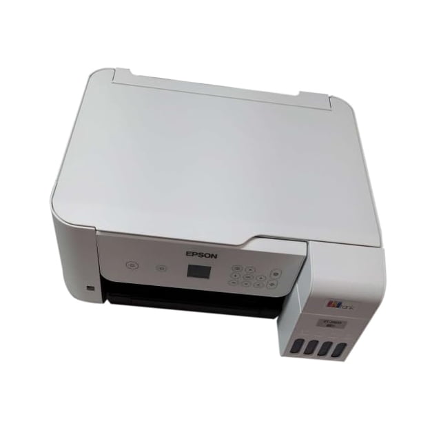 impresora multifunción epson ecotank 2803 de inyección de tinta sin cartucho vista frontal 3/4, unidad blanca compacta con tanque de tinta visible a la derecha, panel frontal con botones y pantalla LCD de 1.44" y bandeja de salida negra desplegada; conectividad inalámbrica y USB, adecuada para impresión, copia y escaneo en oficina en casa y para imprimir fotos y documentos carta.