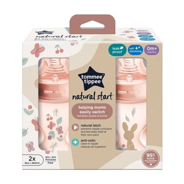 biberón tommee tippee natural start 9oz, rosa Paquete frontal con dos biberones rosa de 9 oz (260 ml) con tetina de silicona Natural Start; vista centrada, cuerpo con estampado de flores y conejito, caja con ventana transparente y rótulos que indican anti-cólico y uso desde 0+ meses. Es adecuado también para llevar en pañalera por su tamaño compacto.