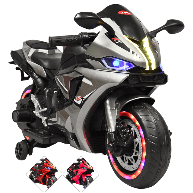 moto montable eléctrica para niños luces led sonido batería 12v ruedas con luz - gris vista frontal 3/4 de moto infantil gris con carrocería de plástico PP y gráficos 'RT', asiento doble, manubrio con acelerador derecho y pedal de freno. Luces delanteras y LED en frontal y ruedas encendidas, ruedas de equilibrio laterales, panel con entrada USB y auxiliar y control de volumen, motor trasero; incluye batería 12V y cargador. Medidas 100 x 42 x 51 cm, capacidad 30 kg, recomendada 3–6 años. También suele utilizarse para sesiones de juego y fotografía infantil.