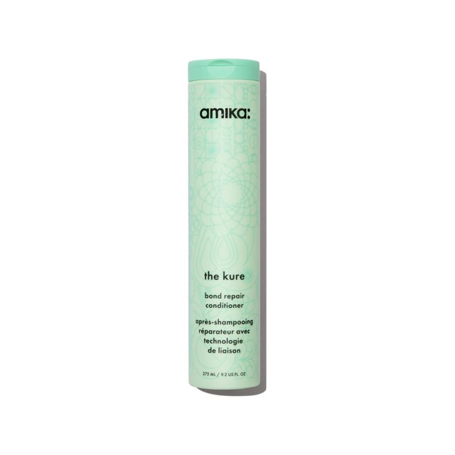 acondicionador amika the kure bond repair 275 ml botella vertical color menta con diseño geométrico floral y logo 'amika', texto de etiqueta 'the kure bond bond repair conditioner' legible, envase cilíndrico de 275 ml en vista frontal sobre fondo blanco; a menudo usado como acondicionador intensivo en rutinas de cuidado capilar.