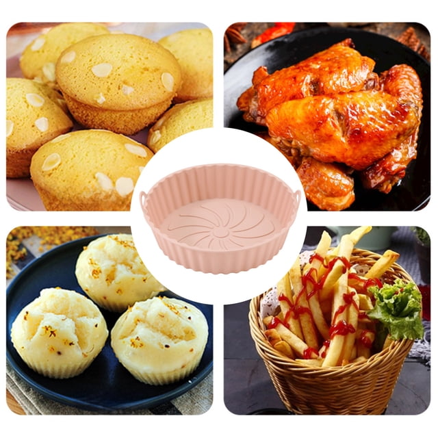 silicone baking sheet | heat-resistant flexible non-stick baking pan | oil separation feature | easy clean | 7x7x2in gray pink green kitchen accessories. Front-facing 7x7x2 in round silicone baking pan in pink with scalloped sides, two small handles and a central oil-drain pattern; matte food-grade silicone texture visible; shown alongside muffins, chicken wings and fries to indicate oven, air fryer and microwave use; often used for baking, roasting or crisping and easy to clean.
