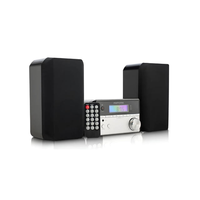 microcomponente bluetooth memorex mx-mcd200 cd micro negro, vista frontal con reproductor central y dos bocinas separadas; chasis plateado con pantalla LED, botones de control y perilla de volumen a la derecha, control remoto apoyado al frente y rejillas negras en las bocinas; compatible con CD, Bluetooth, USB, entrada AUX 3.5 mm y radio FM PLL; tamaño compacto ideal para escritorios o recámaras y suele utilizarse también para reproducir audio de dispositivos móviles en espacios pequeños.