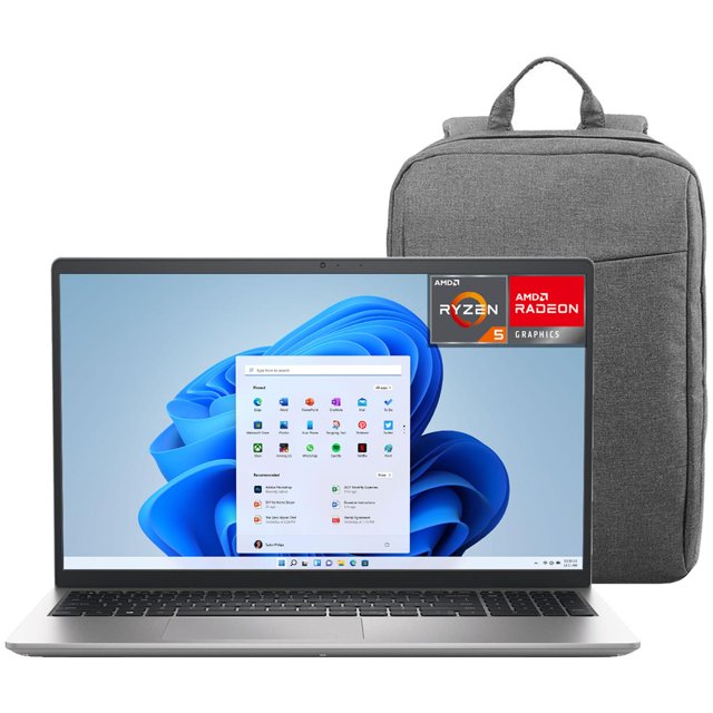 laptop dell 15 amd ryzen 5 7520u 8gb ram 512gb ssd 15.6" teclado en español windows 11 home + mochila Dell Inspiron 15 plateada, vista frontal con pantalla 15.6" IPS Full HD 120Hz mostrando Windows 11, teclado chiclet en español con bloque numérico, touchpad amplio y biseles delgados; mochila gris incluida, suele usarse para clases en línea y trabajo móvil.