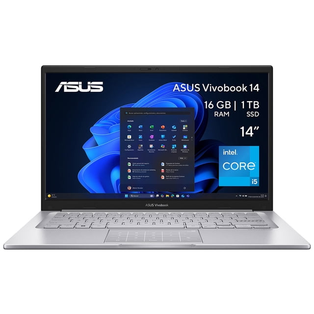 laptop asus vivobook f1404va-nk1055x: portátil plateada abierta, vista frontal centrada de 14" LED con teclado y touchpad; pantalla muestra Windows 11 Pro y etiquetas visibles Intel Core i5 1334U, 16GB DDR4, 1TB SSD y Video Iris Xe; logos ASUS en bisel superior e inferior. También suele usarse como equipo portátil para tareas de oficina y estudio.