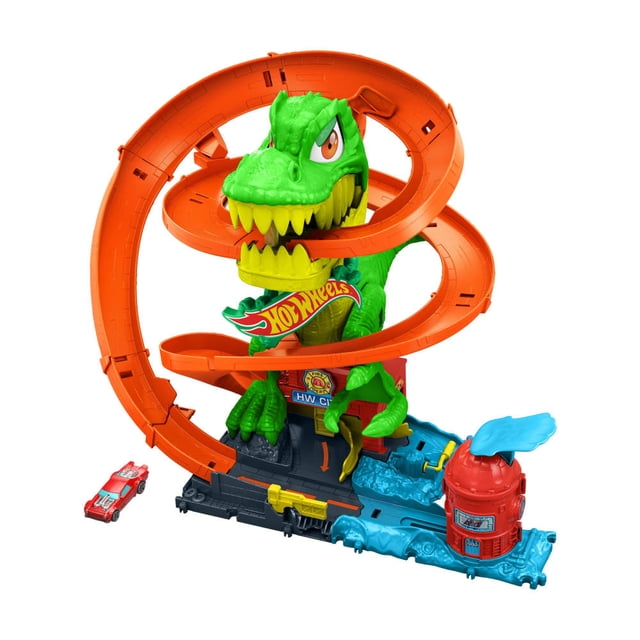 pista de juguete mattel hot wheels t-rex vs estación de bomberos multicolor con T-Rex verde de gran escala y ojos móviles en el centro, rampa espiral naranja alrededor del dinosaurio, base azul y gris con detalles de estación de bomberos y tanque rojo, incluye camión de bomberos die-cast 1:64 visible; espacio para guardar vehículos y brazos articulados que reaccionan al paso de los autos, a menudo usado para juego de simulación de rescate.