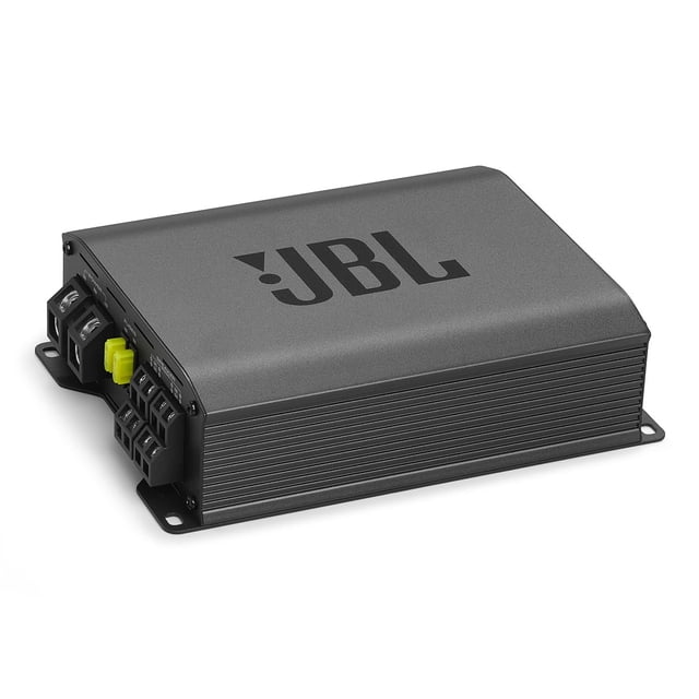 amplificador de coche jbl stage gt 60041 1240w class-d Amplificador clase D compacto en vista 3/4 con carcasa gris antracita y logo JBL en la tapa, disipador lateral ranurado y bornes de conexión visibles; incluye control de crossover y ecualizador de graves ajustable, montaje de perfil bajo para espacios reducidos y a menudo usado para impulsar subwoofers en sistemas de audio para autos.