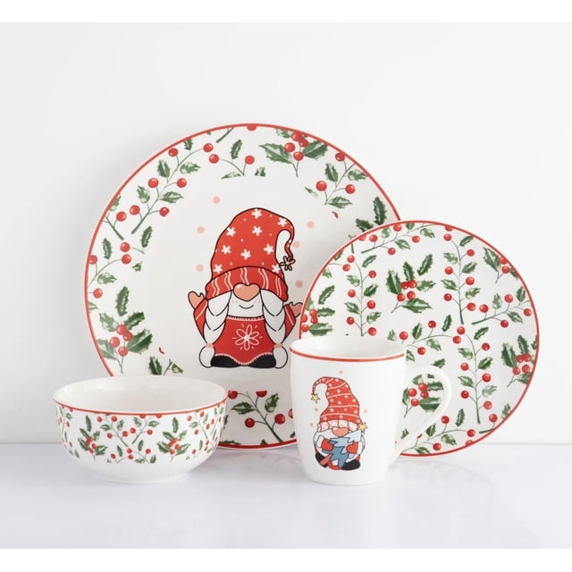 vajilla navideña vascella porcelana para 4 personas 16pz Conjunto de porcelana para 4 personas con 4 platos llanos 10.5" (26.6 cm), 4 platos de postre 7.5" (19 cm), 4 tazones 5.5" (14 cm) y 4 tazas 12 oz (355 ml). Vista frontal sobre fondo blanco, borde rojo y decoración navideña con ramas verdes, bayas rojas y motivos de duende con gorro rojo; adecuada para cenas festivas y para servir postres o bebidas calientes.