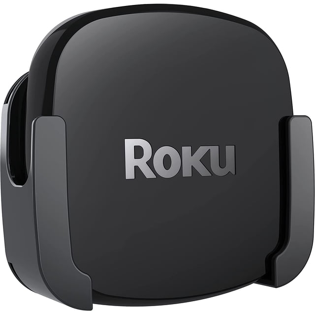 totalmount para roku ultra compatible con todos los modelos soporte de pared negro, vista frontal centrada del soporte cuadrado con el logotipo Roku en el centro, dos brazos laterales curvos que sujetan el reproductor y base recortada; plástico moldeado visible, diseñado para montarse detrás de una TV o en la pared y a menudo usado para organizar pequeños reproductores de streaming.