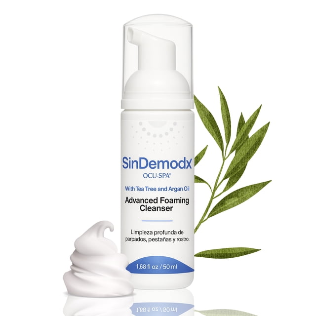 espuma limpiadora de pestañas y párpados sindemodx ocu-spa envase dispensador blanco 50 ml con logo SinDemodx, espuma transparente junto a hojas de árbol del té, vista frontal centrada; uso recomendado para limpieza diaria y nocturna de párpados y pestañas, ideal para integrar en la rutina de higiene ocular.
