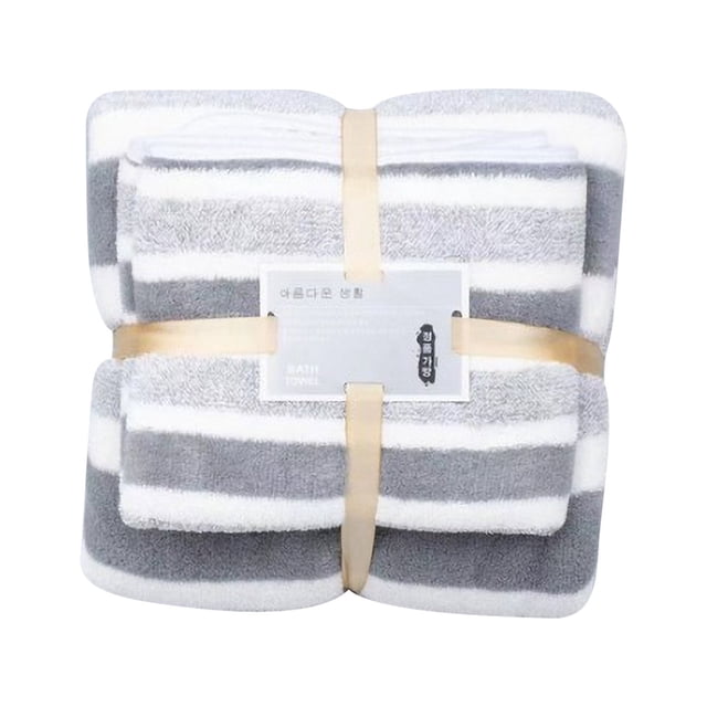 gray coral velvet striped bath towel set 2-piece absorbent cotton towels for bathroom and spa Conjunto de 2 toallas gris y blanco con franjas, vista frontal plegada; incluye toalla de baño 73 x 140 cm y toalla de rostro 35 x 75 cm, felpa de algodón aterciopelado de alta absorción visible, embaladas con cinta. También suelen emplearse para spa, gimnasio o viajes de camping.