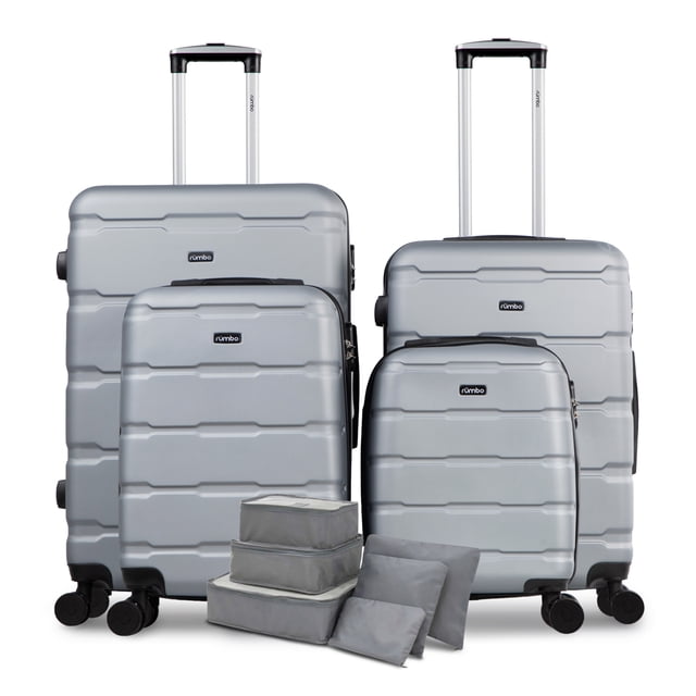 juego 4 maletas de viaje rigidas rumbo 6 bolsas de viaje gris Set de 4 maletas Rumbo en gris (16, 20, 24 y 28 pulgadas) con carcasa ABS, tiradores telescópicos, ruedas giratorias y candados integrados; vista frontal con las cuatro siluetas alineadas y seis bolsas organizadoras de poliéster al frente, ideales para organizar ropa y zapatos durante el viaje.