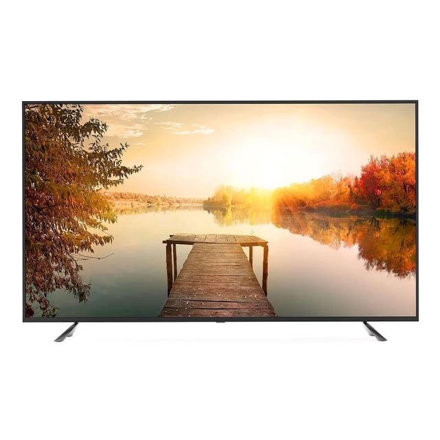 tv 70 pulgadas smart tv uhd 4k daw70ur daewoo led multicolor. Vista frontal centrada de pantalla grande que muestra un muelle al amanecer; marco delgado negro y peanas en ambos extremos. Especificaciones visibles en ficha: UHD 3840 x 2160, sistema operativo Roku TV, 4 entradas HDMI y 2 USB. También es adecuada para usar como pantalla principal en salas de entretenimiento doméstico.