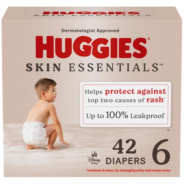 pañales huggies skin essentials tamaño 6 para bebé (más de 16 kg) x42 caja frontal con logo Huggies grande, 'Skin Essentials', número '42' y talla '6'; vista frontal centrada con bebé de perfil sentado usando pañal, texto que indica hasta 100% a prueba de fugas y 'Dermatologist Approved'.