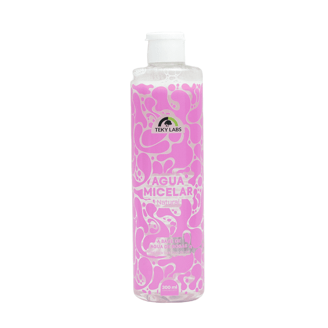 agua micelar teky labs desmaquillante natural para todo tipo de piel 300 ml Botella frontal centrada, transparente con líquido claro y etiqueta rosa con patrón orgánico y logo Teky Labs; muestra que contiene agua de rosas, aceite de almendras, glicerina vegetal y cocamidopropil betaína, fórmula sin alcohol ni parabenos para limpiar, desmaquillar e hidratar pieles sensibles, secas o mixtas. Tamaño de 300 ml, suele usarse también como limpiador rápido al viajar.