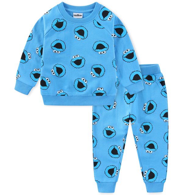 conjunto de ropa sesame street elmo y monstruo de las galletas para niños, conjunto 2 piezas con camiseta de manga larga y pantalón a juego en azul con estampado repetido del Monstruo de las Galletas, cuello redondo, puños acanalados y pretina elástica, disponible en tallas 18M–4T, ideal para otoño e invierno.
