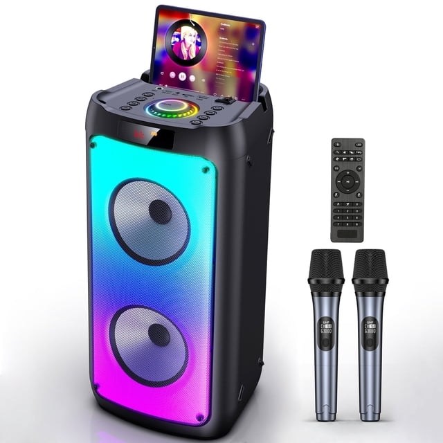 bocina bluetooth portátil jyx con micrófonos y luces dj t10-t Altavoz JYX T10-T vista frontal 3/4, carcasa negra con panel frontal de luces DJ RGB (azul y magenta), dos drivers circulares visibles (woofer y tweeter 4"), bandeja superior con ranura para tablet y controles, incluye 2 micrófonos inalámbricos y control remoto; puertos USB/TF/AUX, asa de transporte y batería hasta 12 h, apta para karaoke y fiestas en casa.