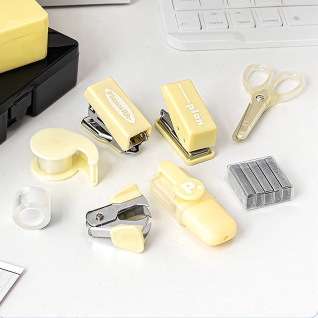 multifunctional toolbox style stationery organizer set | portable punch stapler | durable plastic & metal | compact 4.17x3.5x1.1in | yellow | office supplies storage | 1 piece — front-facing flat-lay of the opened yellow toolbox-style stationery set displaying two compact yellow staplers, a small yellow hand punch, a metal-jawed staple remover, a portable punch-stapler accessory, a strip of staples, clear tape cap and translucent-handle scissors on a white desk near a keyboard; plastic housings with visible metal stapling parts, compact rectangular silhouettes, suitable for organizing pens and small office supplies and often used for portable student or office storage.