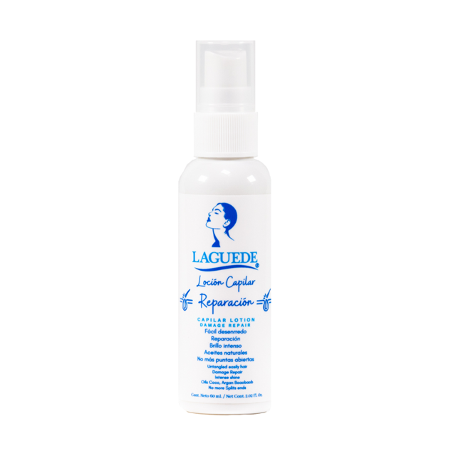 spray capilar laguede para cabello seco capilar spray natural botella blanca frontal con dispensador tipo spray y etiqueta azul LAGUEDE 'Loción Capilar Reparación'; envase cilíndrico sobre fondo blanco; indicado para hidratar, combatir frizz y resequedad, prevenir debilitamiento y ayudar a eliminar caspa; además facilita el desenredo durante el cepillado.