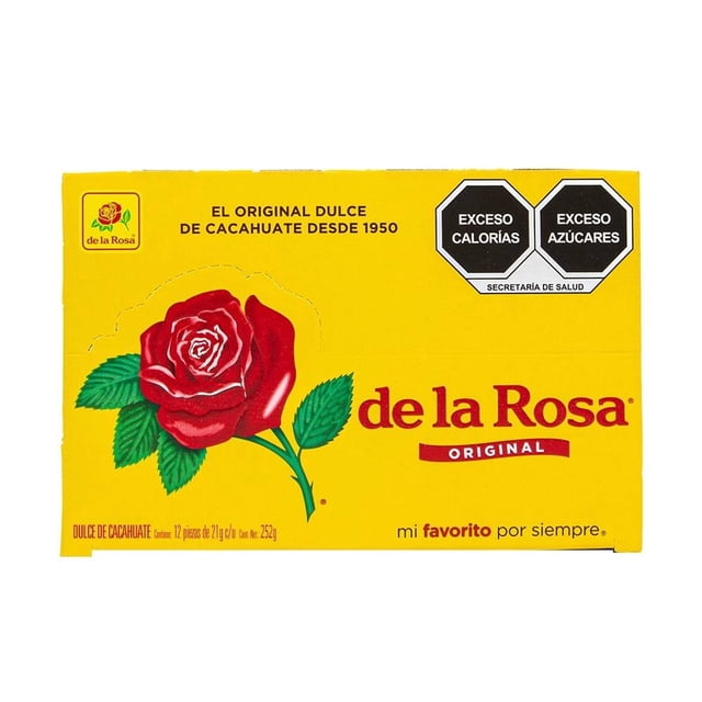 mazapán de la rosa 12 pzas de 21 g c/u caja amarilla frontal con logo De La Rosa, gran rosa roja con hojas verdes, texto 'de la Rosa original' y 'mi favorito por siempre', sellos negros de advertencia 'exceso calorías' y 'exceso azúcares'. Golosina mexicana de cacahuate en porciones individuales.