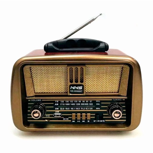 radio bt linkbits retro vintage, vista frontal centrada de radio bluetooth retro con antena telescópica; carcasa dorada y rejilla de altavoz beige, perillas de volumen y sintonía, indicador de bandas AM/FM/SW, ranura para tarjeta SD y puerto USB 5V, asa plegable superior; también suele usarse para reproducir MP3 desde tarjetas SD en viajes.