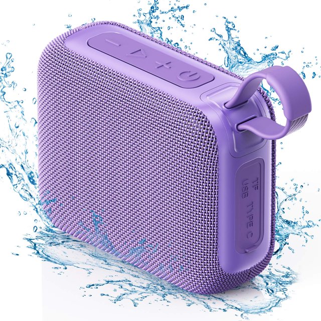 bocina jyx, altavoz bluetooth portátil, altavoz para exteriores impermeable ipx5, mini altavoz inalámbrico con subwoofer de 10 w, 6-8h de reproducción, altavoz para fiestas en casa, viajes, l3 bocina JYX morada en vista 3/4 frontal: compacto rectángulo con rejilla textil, botones (+, -, play) en el borde superior y anillo de transporte en la esquina; puerto TF/USB cubierto en el lateral; imagen con salpicaduras de agua para indicar resistencia IPX5. Especificaciones visibles: 12 x 4.2 x 14.5 cm, hasta 8 h de batería y subwoofer integrado de 10 W; compatible con Bluetooth y tarjeta TF, adecuada para senderismo, camping y fiestas al aire libre.