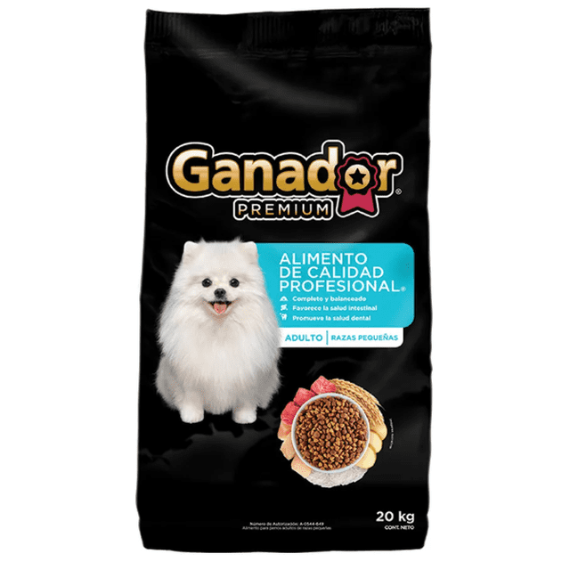 croquetas para perro ganador premium adulto razas pequeñas 20 kg bolsa negra frontal con logo Ganador Premium y texto azul "Alimento de calidad profesional"; fotografía de perro blanco pequeño tipo Pomerania y tazón con croquetas visible, peso 20 kg impreso abajo; también apto como recompensa seca en sesiones de adiestramiento.