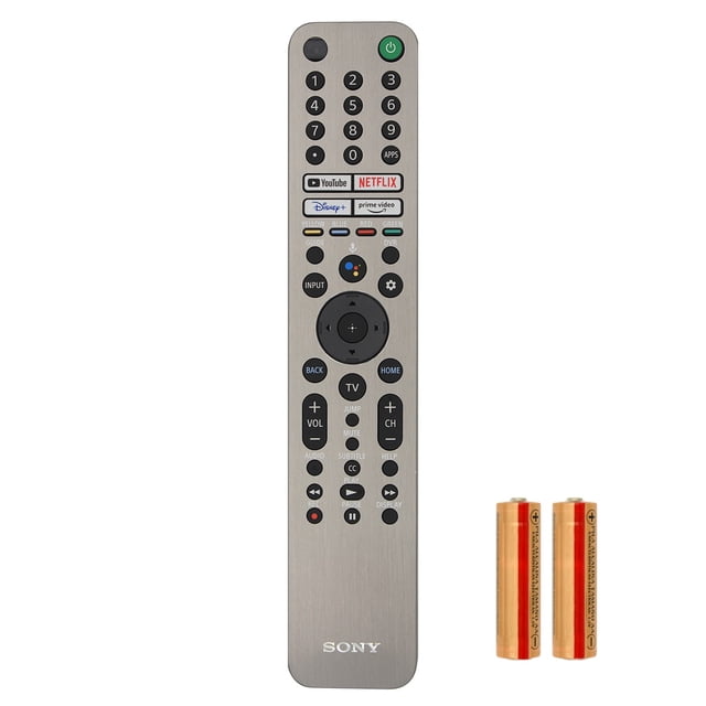 control remoto rmf-tx621u sony original metálico con luz para google tv, vista frontal centrada de mando slim plata y negro con botones numéricos y anillo direccional, micrófono para comando de voz, teclas directas Netflix YouTube Disney+ y Prime Video, logotipo Sony en la base e incluye dos pilas AA; también suele usarse como reemplazo en setups de entretenimiento doméstico.