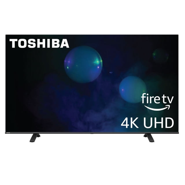 pantalla 65 pulgadas toshiba fire tv, televisor 65 pulgadas 4K UHD con marcos delgados y soporte de dos patas, vista frontal centrada con gráficos espaciales, logotipo Toshiba en esquina superior izquierda y texto 'fire tv 4K UHD' en pantalla; compatible con Alexa y Apple AirPlay, audio con DTS Virtual:X; también suele usarse como pantalla principal para salas de entretenimiento.