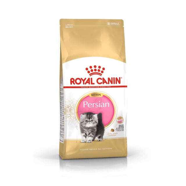 alimento croqueta gato royal canin persa cachorro1.3k 542703 Bolsa frontal 1.3 kg de Royal Canin Persian Kitten; vista frontal, empaque dorado y blanco con logotipo rojo, etiqueta rosa con la palabra Persian y foto de un gatito persa gris sentado; texto de composición y sellos nutricionales en el lateral, empaque de pie sobre fondo blanco. Suele usarse también como ración seca práctica para viajes cortos con gatitos persas.