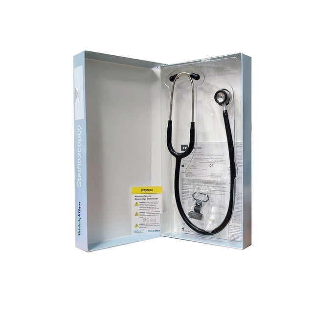 estetoscopio pediátrico welch allyn WALCH ALLYN doble campana negro en caja abierta, vista frontal con tubos negros, binaurales metálicos y campana visible junto a manuales y accesorios; suele usarse para auscultación pediátrica.