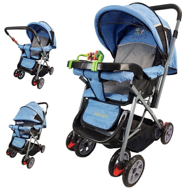 carriola reversible the baby shop h-b con toldo plegable 3 posiciones azul; vista 3/4 frontal que muestra asiento reversible y reclinable en 3 posiciones, arnés de 2 puntos, charola desmontable con juguetero, toldo de tres posiciones con ventana de malla, reposapiernas ajustable, canastilla amplia y freno en llantas traseras. Apta para 6 meses–3 años (hasta 16 kg); también suele usarse para paseos cortos y transportar pañalera.