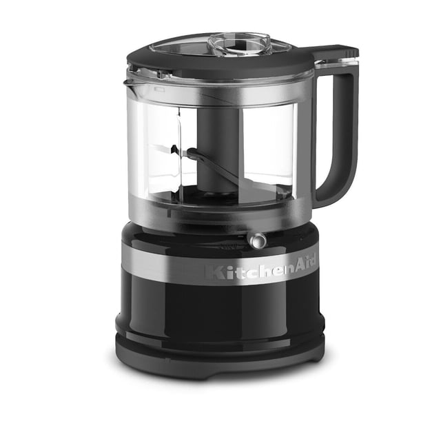 procesador de alimentos kitchenaid kfc3516ob 830 ml, 3.5 tazas, ónix negro, vista frontal con vaso transparente y cuchilla en X, asa lateral y tapa con tolva; base compacta en ónix negro con franja metálica y logo KitchenAid. Adecuado para procesar porciones pequeñas y a menudo usado para preparar papillas o salsas en porciones para bebés.