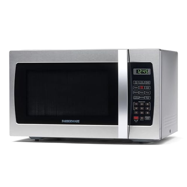 farberware countertop microwave 1000 watts, 1.3 cu. ft. - microwave oven with led lighting and child lock - perfect for apartments and dorms - easy clean stainless steel vista frontal de microondas Farberware de acero inoxidable 1.3 cu. ft. y 1000 W, con gran ventana oscura y logotipo centrado, panel de control derecho con pantalla digital verde (12:45), teclado numérico y botones de un toque, asa vertical de acero cepillado y exterior liso; compacto, ideal para departamentos, dormitorios u oficinas; a menudo se usa como microondas auxiliar para preparación rápida.