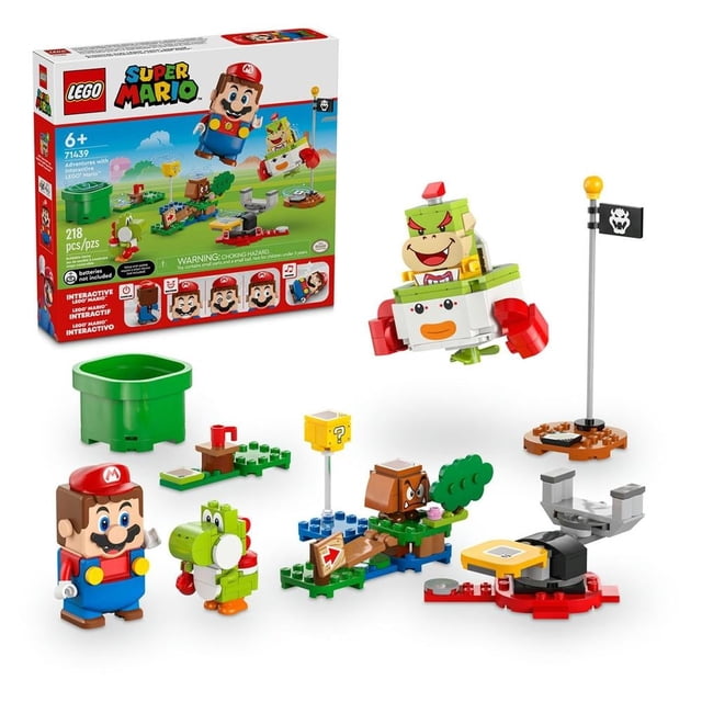 set lego super mario aventuras interactivas con lego mario 71439 escena frontal con figura interactiva LEGO Mario, Bowser Jr. en cápsula Koopayaso, Yoshi y Goomba; incluye tubería inicial verde, bloque ? amarillo, plataforma de equilibrio, banderín y varios módulos de terreno para recrear niveles y coleccionar monedas en el juego.