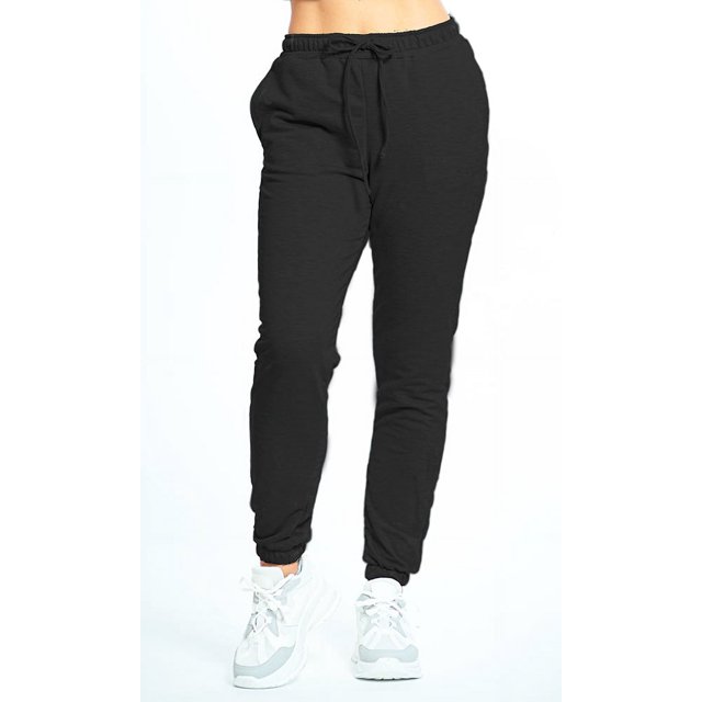 pants jogger para mujer shendy vendy slim fit negro. Vista frontal centrada de cintura media elástica con cordón ajustable, piernas cónicas y bolsillos laterales en tela French Terry de secado rápido con estiramiento en 2 direcciones; puños elásticos tipo jogger. Adecuados para descansar, caminar o uso casual.
