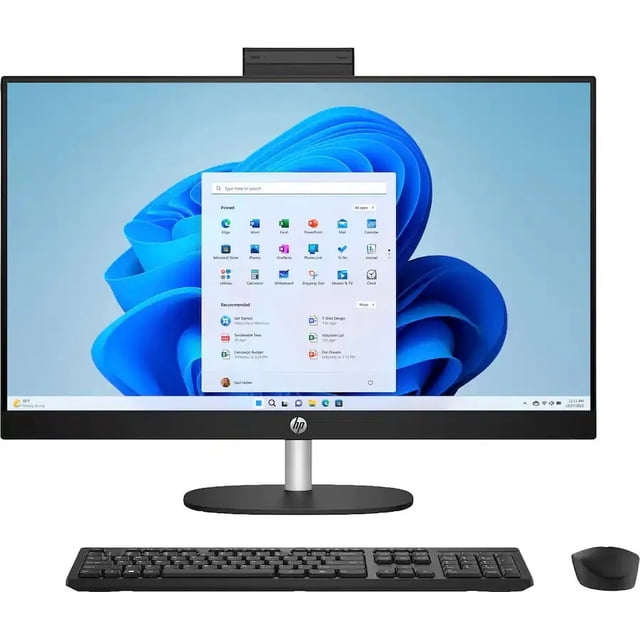 computadora hp - 24" all-in-one- ryzen 5 - 16gb - 512gb ssd Computadora all-in-one HP de 24" vista frontal centrada con pantalla táctil Full HD mostrando Windows 11 Home, marco inferior delgado con logo HP, soporte metálico cilíndrico y base ovalada; teclado y mouse inalámbricos frente al equipo; a menudo se usa también como estación compacta para videoconferencias.
