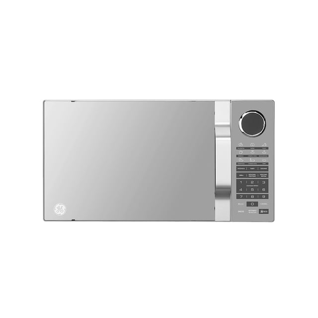 microondas ge función eco 1.4 pies cúbicos espejo con grill digital 10 potencias. Vista frontal centrada del microondas Mabe con puerta tipo espejo y manija cromada a la derecha; panel digital con rueda, botones numéricos, iconos de 9 menús automáticos, controles de descongelado por peso y marcadores de 10 niveles de potencia. Logo GE en la esquina inferior izquierda; apto para recalentar y dorar con grill, y a menudo usado para calentar recipientes durante viajes.