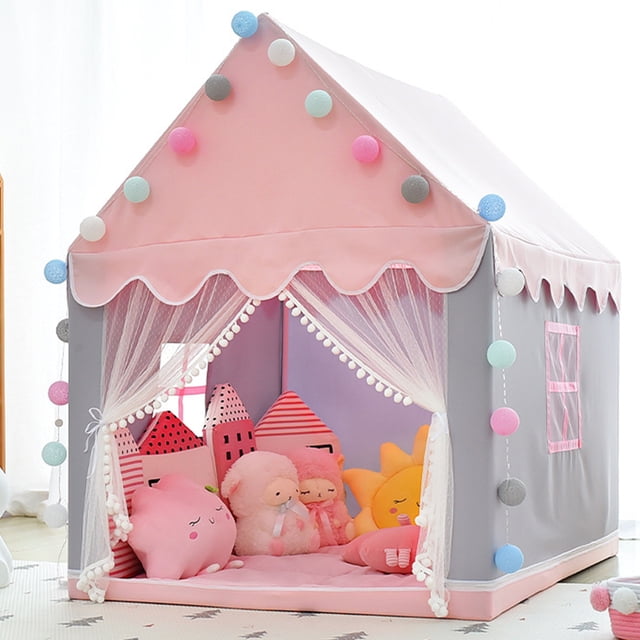 hvxrjkn tienda de campaña de princesa casa de juguetes, tienda play para niños, castillo grande tipi para niños, casa de juegos para interiores y exteriores 51,2 x 39,4 x 47,2, rosa Vista frontal de casa de juegos tipo castillo en tela rosa y gris con techo puntiagudo, cortinas de tul abiertas con borlas, base acolchada rosa y guirnaldas de pompones; ventana lateral decorativa y interior con cojines y peluches que muestran el espacio de juego de 51,2 x 39,4 x 47,2 pulgadas, adecuada para niñas y niños, fácil de plegar e instalar; también suele usarse como rincón de lectura o para siestas cortas.