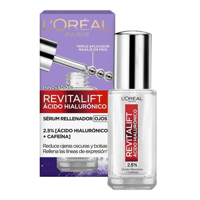 sérum rellenador ojos loreal revitalift ácido hialurónico 20 ml frontal con frasco de vidrio transparente y tapa metálica plateada junto a su caja morada y roja con gráfico de aplicador; etiqueta muestra "REVITALIFT ÁCIDO HIALURÓNICO 2.5% + CAFEÍNA" y la caja indica uso contra los signos de la edad; adecuado para el cuidado del contorno de ojos y también apto como tratamiento complementario para pieles con líneas finas en el área periorbital.