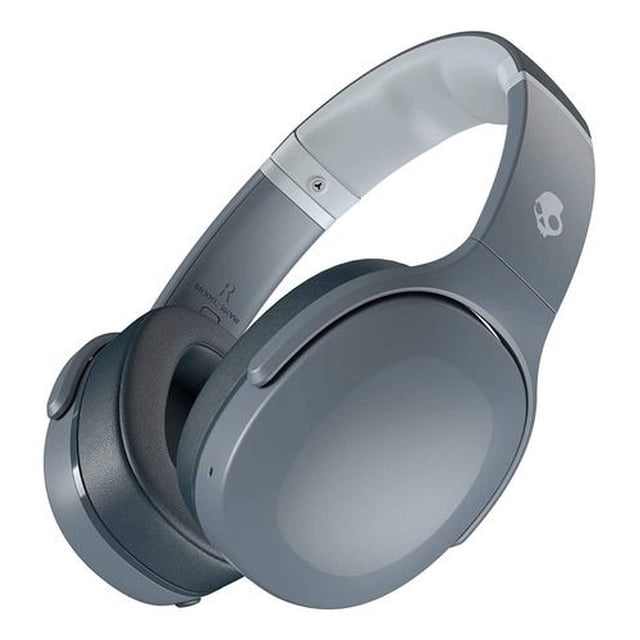 audífonos inalámbricos crusher evo skullcandy color gris auriculares circumaurales over-ear en vista 3/4 con diadema acolchada, copas mate lisas y logo Skullcandy en la orejera; especificaciones indican Crusher Bass patentado, Bluetooth y ajuste de graves, aptos para viajes y uso diario.
